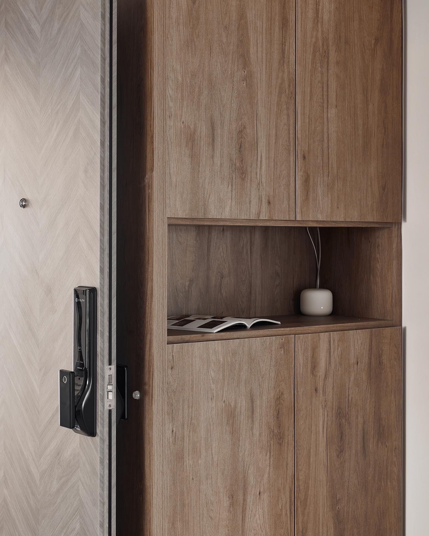 Timber shoe cabinet with open niche by the entrance